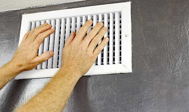 hands in front of air vent